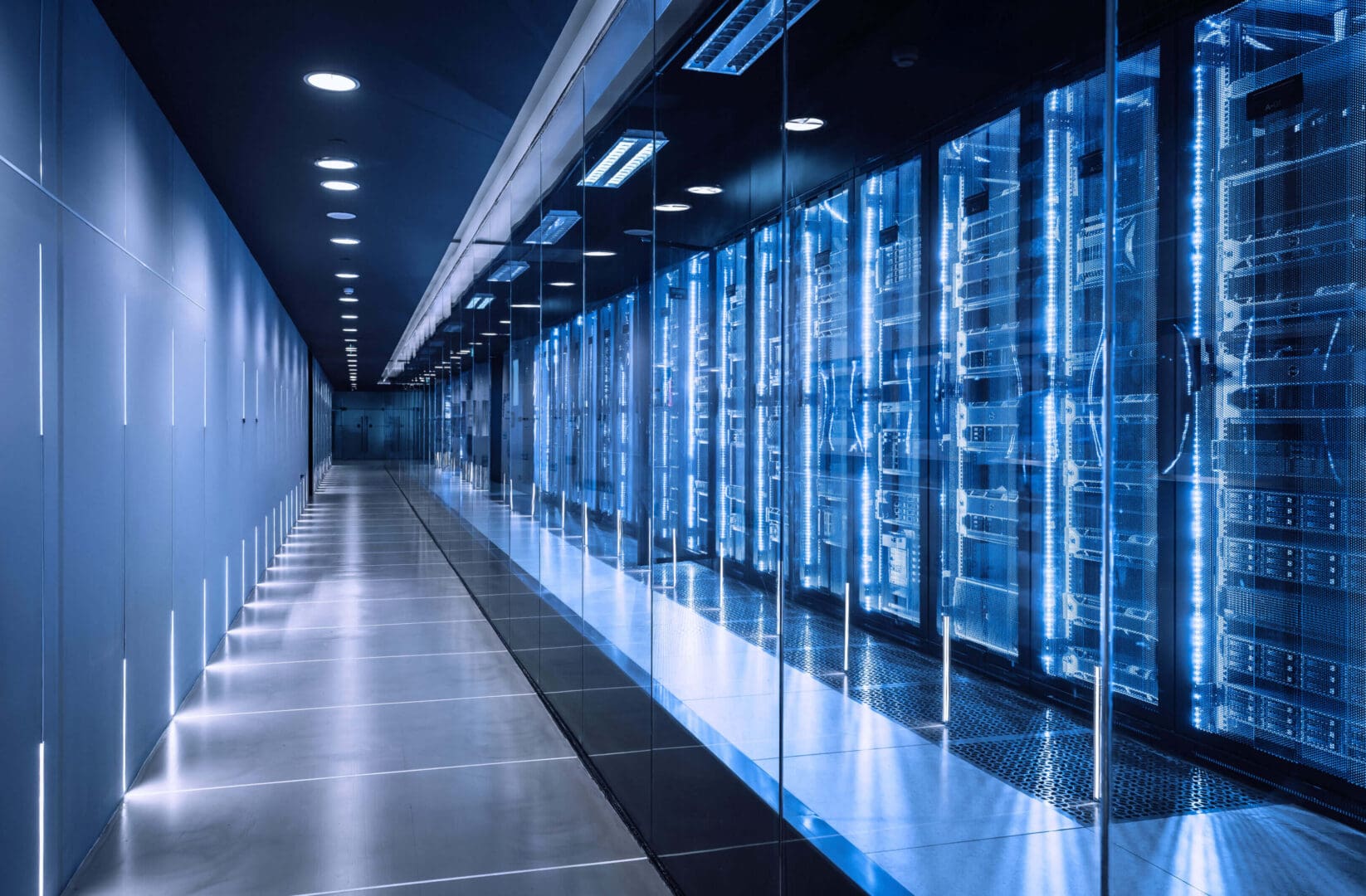 Modern server room with rows of illuminated data racks.