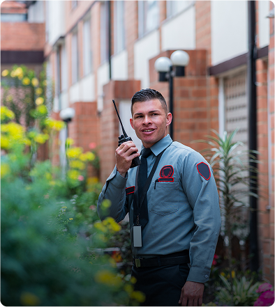 Security guard speaking into a walkie-talkie.