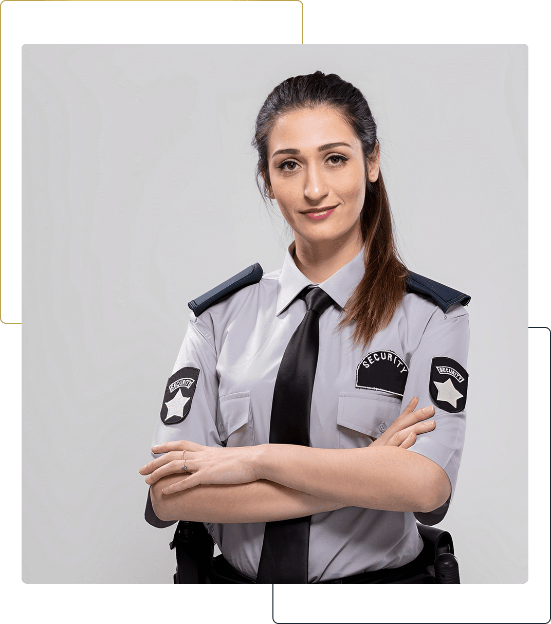 Confident female security guard in uniform with arms crossed.