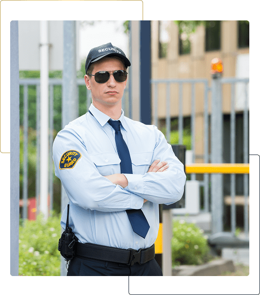 Security guard standing with arms crossed.
