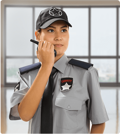 Security guard speaking into a walkie-talkie.