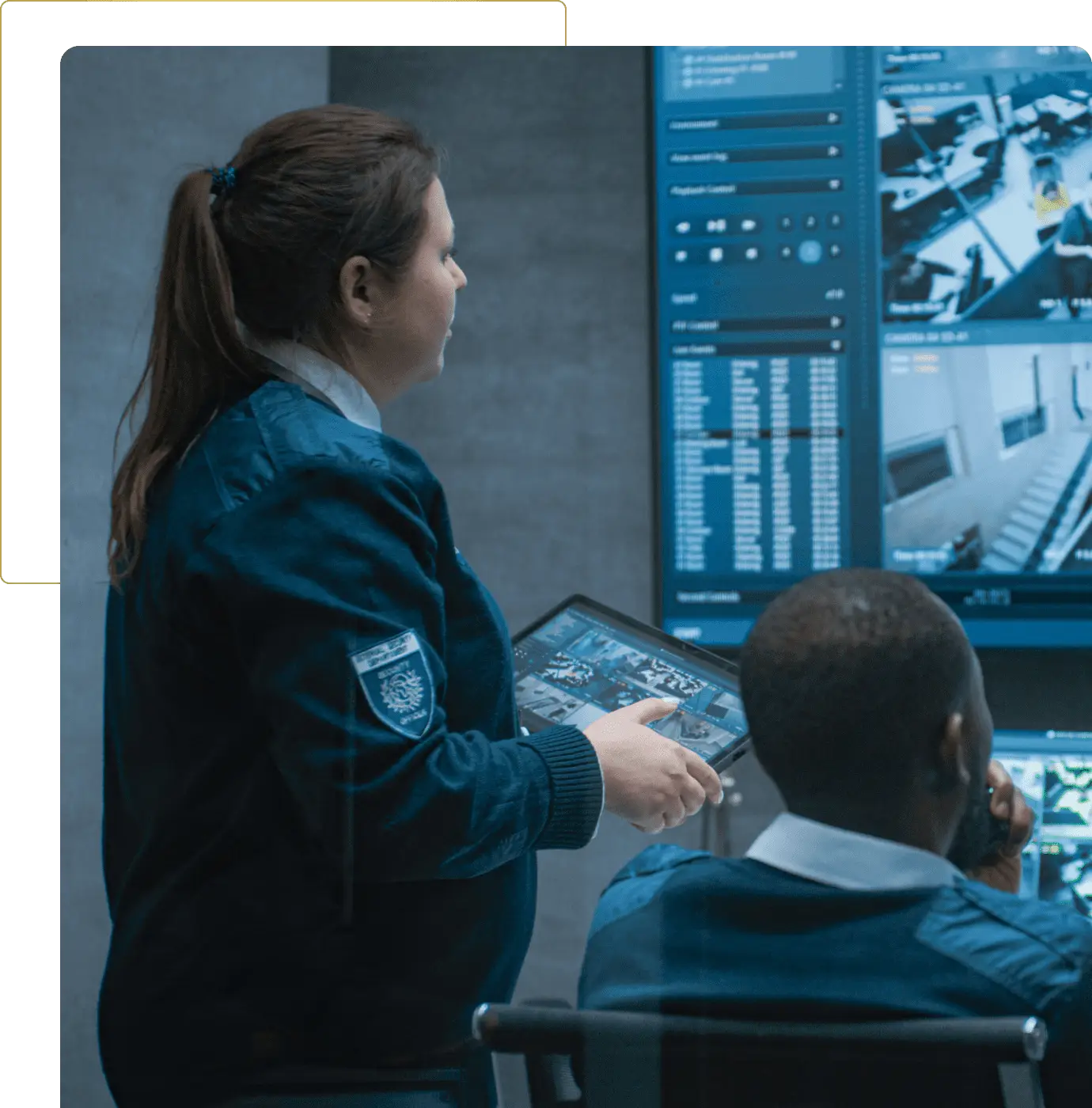 Security personnel monitoring surveillance screens.