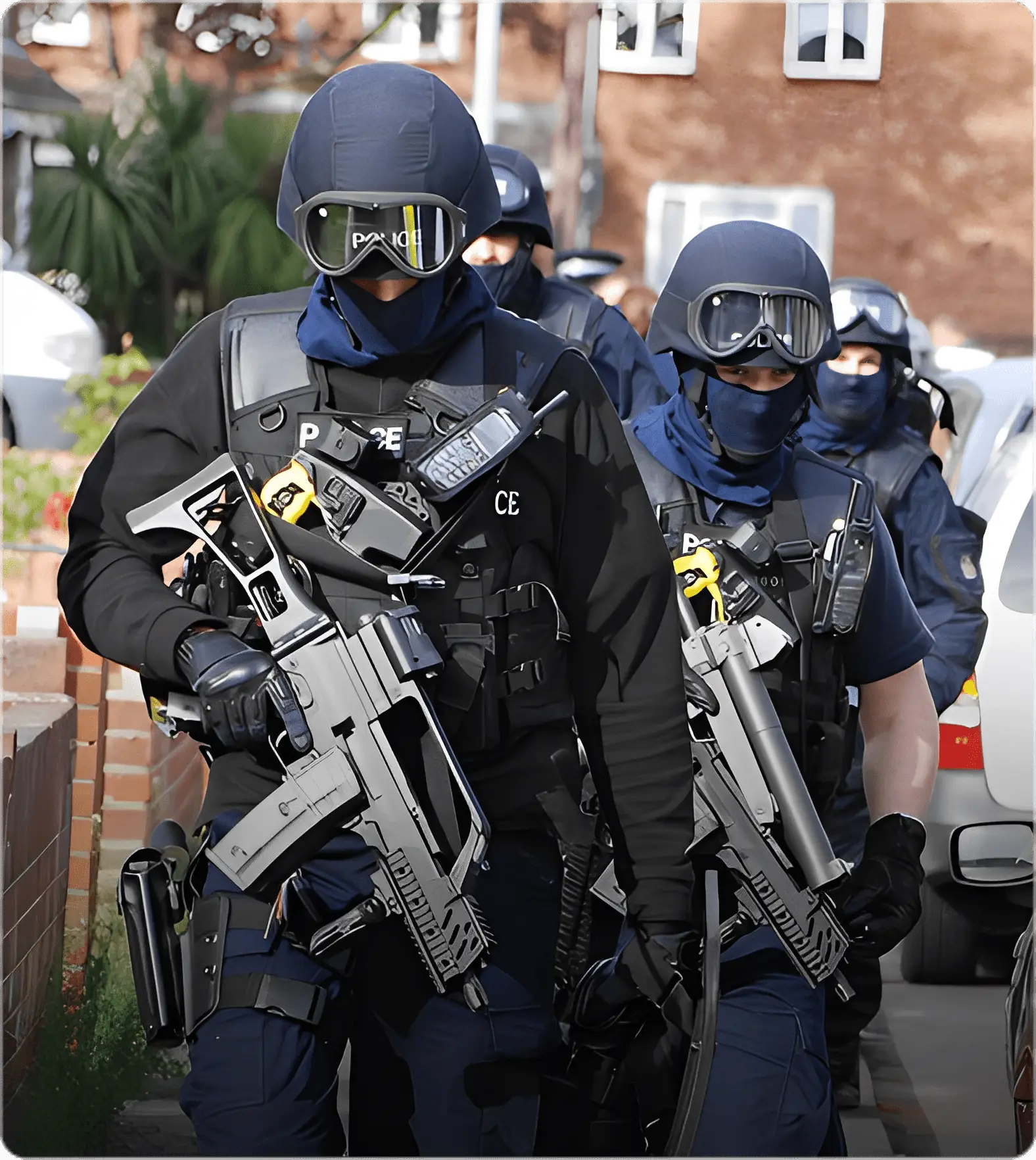 Armed officers in tactical gear on patrol.